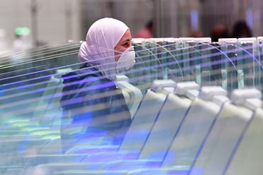 A tourist waits to have her papers checked upon arrival at Teminal 3 at Dubai airport, in the United Arab Emirates. (AFP)