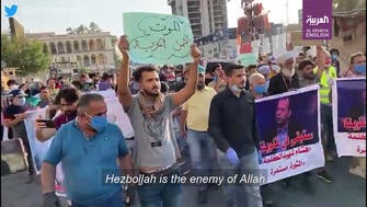 Iraqi protesters chant anti-Hezbollah slogans during slain al-Hashemi’s funeral march