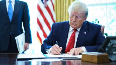 US President Donald Trump signs an executive order on Iran sanctions in the Oval Office of the White House on June 24, 2019. (AFP)