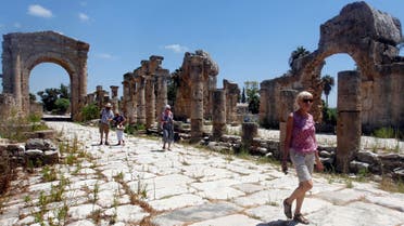 Tourists walk at the Roman ruins in Tyre, Southern Lebanon August 4, 2017. (Reuters)