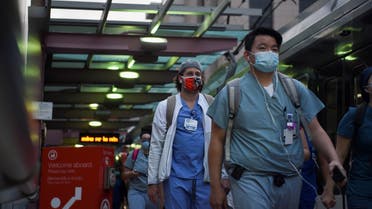 Healthcare workers walk through the Texas Medical Center as cases of the coronavirus spike in the United States, July 8, 2020. (Reuters)