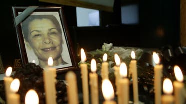 Iranian journalists light candles for the Iranian-Canadian freelance photographer Zahra Kazemi (picture) who died while under arrest in Tehran, during a one-day strike marking 'Journalist Day' 08 August 2003. (AFP)