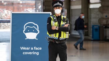 A police officer wears a face mask in London, UK, on June 15, 2020. (AFP)