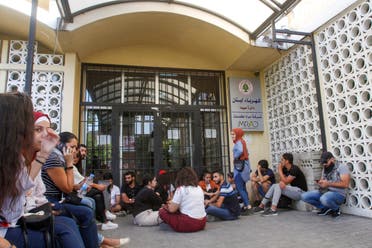 Lebanese demonstrators block the entrance of the electricity company in the southern city of Sidon (Saida) on November 12, 2019, during ongoing anti-government demonstrations. (AFP)