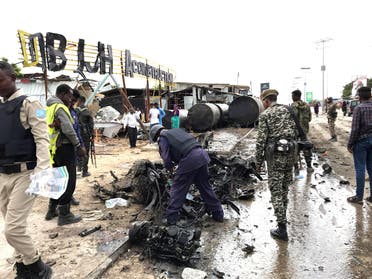 Somali security officers assess the wreckage of a car destroyed at the scene of an explosion in Mogadishu, Somalia. (File photo: Reuters)