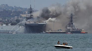 Smoke rises from a fire on board the US Navy amphibious assault ship USS Bonhomme Richard at Naval Base San Diego. (Reuters)