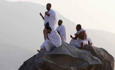 Muslim pilgrims pray on Mount Mercy on the plains of Arafat in the early morning during the peak of the annual Hajj pilgrimage, near the holy city of Mecca. (Reuters)