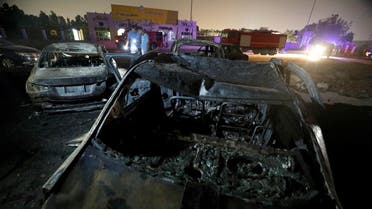 Burned vehicles are seen following a fire that broke out in Egypt's Shuqair-Mostorod crude oil pipeline, at the beginning of Cairo-Ismailia road, Egypt July 14, 2020. (Reuters)