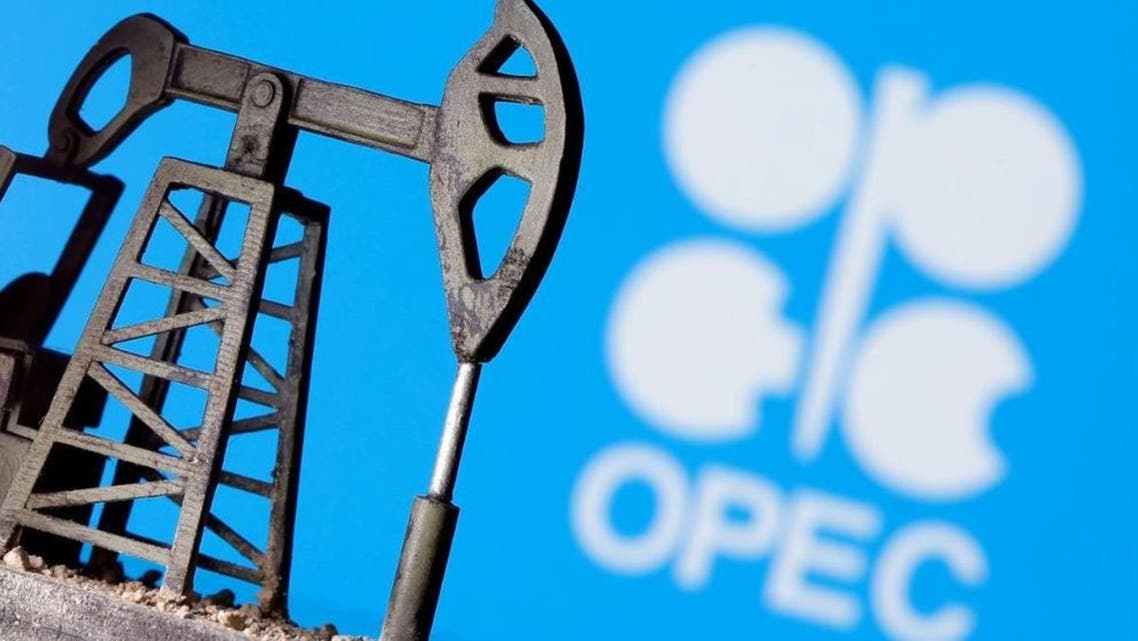 A 3D printed oil pump jack is seen in front of displayed Opec logo in this illustration picture, April 14, 2020. (Reuters)