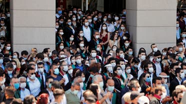 Riot police stand guard next to the lawyers as they gather in front of the Palace of Justice to protest against a draft bill governing the organisation of bar associations, in Istanbul, Turkey June 30, 2020. REUTERS/Murad Sezer