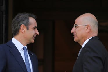 وزير الخارجية اليوناني دندياس مع رئيس الوزراء اليوناني متسوتاكيس قبل لقاء مع الرئيس القبرصي