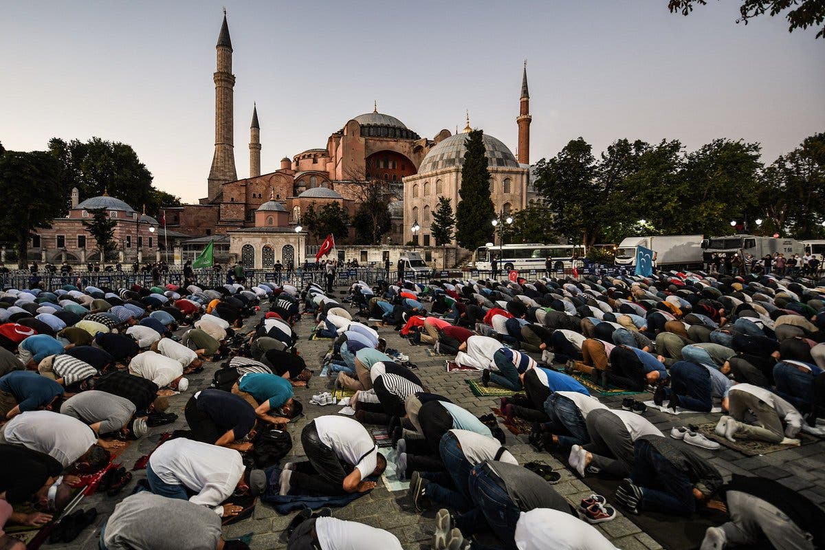 Muslims pray outside the Hagia Sophia. (AFP)
