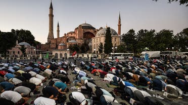 Muslims pray outside the Hagia Sophia. (AFP)