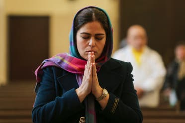 An Iranian Christian prays during mass at the Saint Sarkis Armenian Cathedral in Tehran on January 1, 2020. (File photo: AFP)