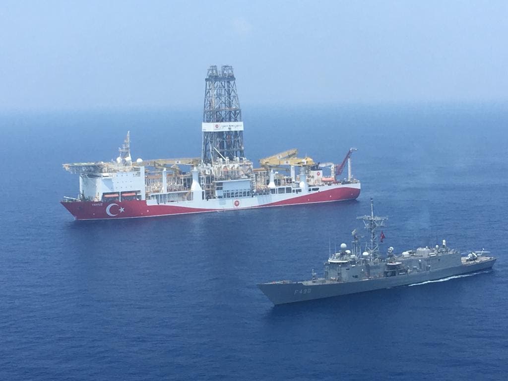 A handout photograph taken and relased by the Turkish Defence Ministery on July 9,2019 shows a Turkish Navy warship patroling next to Turkey's drilling ship Fatih dispatched towards the eastern Mediterranean near Cyprus. (File photo)
