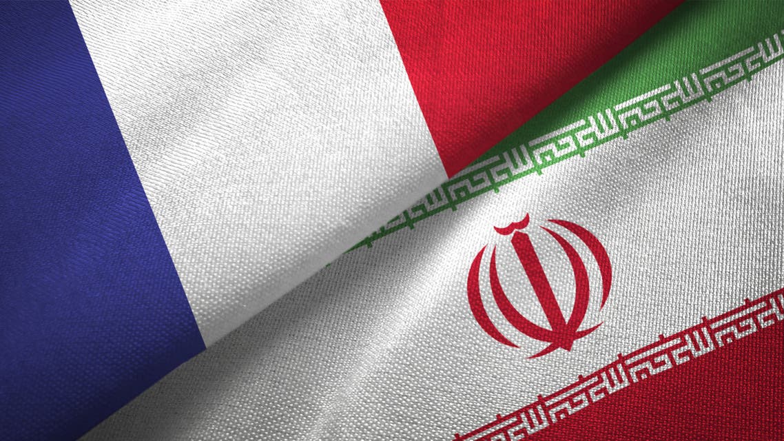 Iran and France two flags together realations textile cloth fabric texture stock photo