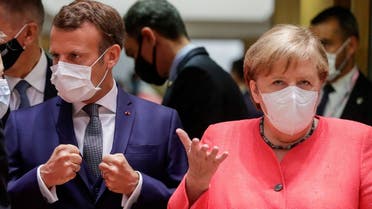 German Chancellor Angela Merkel and French President Emmanuel Macron are seen at the start of the first face-to-face EU summit since the coronavirus outbreak, in Brussels, Belgium, on  July 17, 2020. (Reuters)