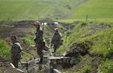 Ethnic Armenian soldiers stand in a trench at their position near Nagorno-Karabakh's town of Martuni. (File photo: Reuters)
