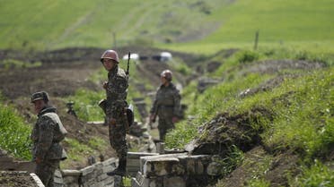 Ethnic Armenian soldiers stand in a trench at their position near Nagorno-Karabakh's town of Martuni, April 8, 2016. REUTERS/Staff