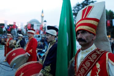 Members of traditional Ottoman band Mehter perform before breaking fast at Sultanahmet Square on the first day of the holy fasting month of Ramadan in Istanbul, Turkey May 16, 2018. (Reuters)