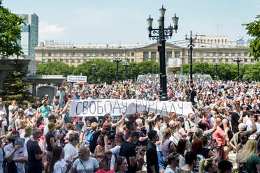 000_1People hold a banner reading “Freedom for Furgal!, during an unauthorized rally in support of Sergei Furgal, the governor of the Khabarovsk region in the Russian far eastern city of Khabarovsk on July 18, 2020. (AFP)VD93B