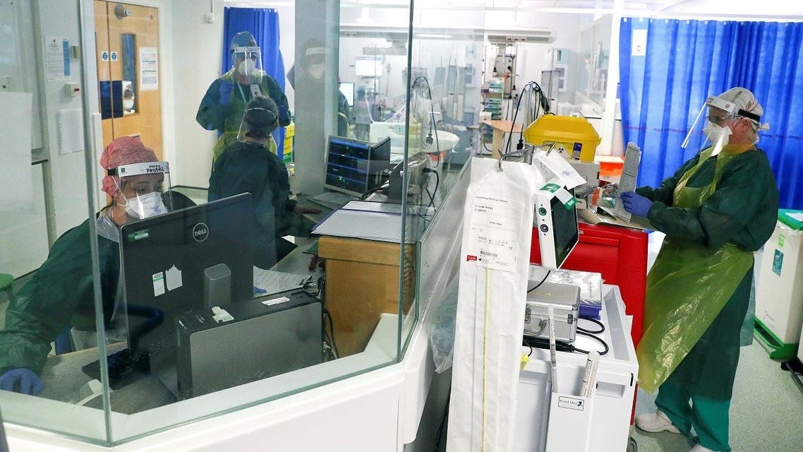 Medical staff work on an Intensive Care Unit (ICU) ward treating patients with COVID-19, at Frimley Park Hospital in Frimley, southwest England on May 22, 2020. (AFP)