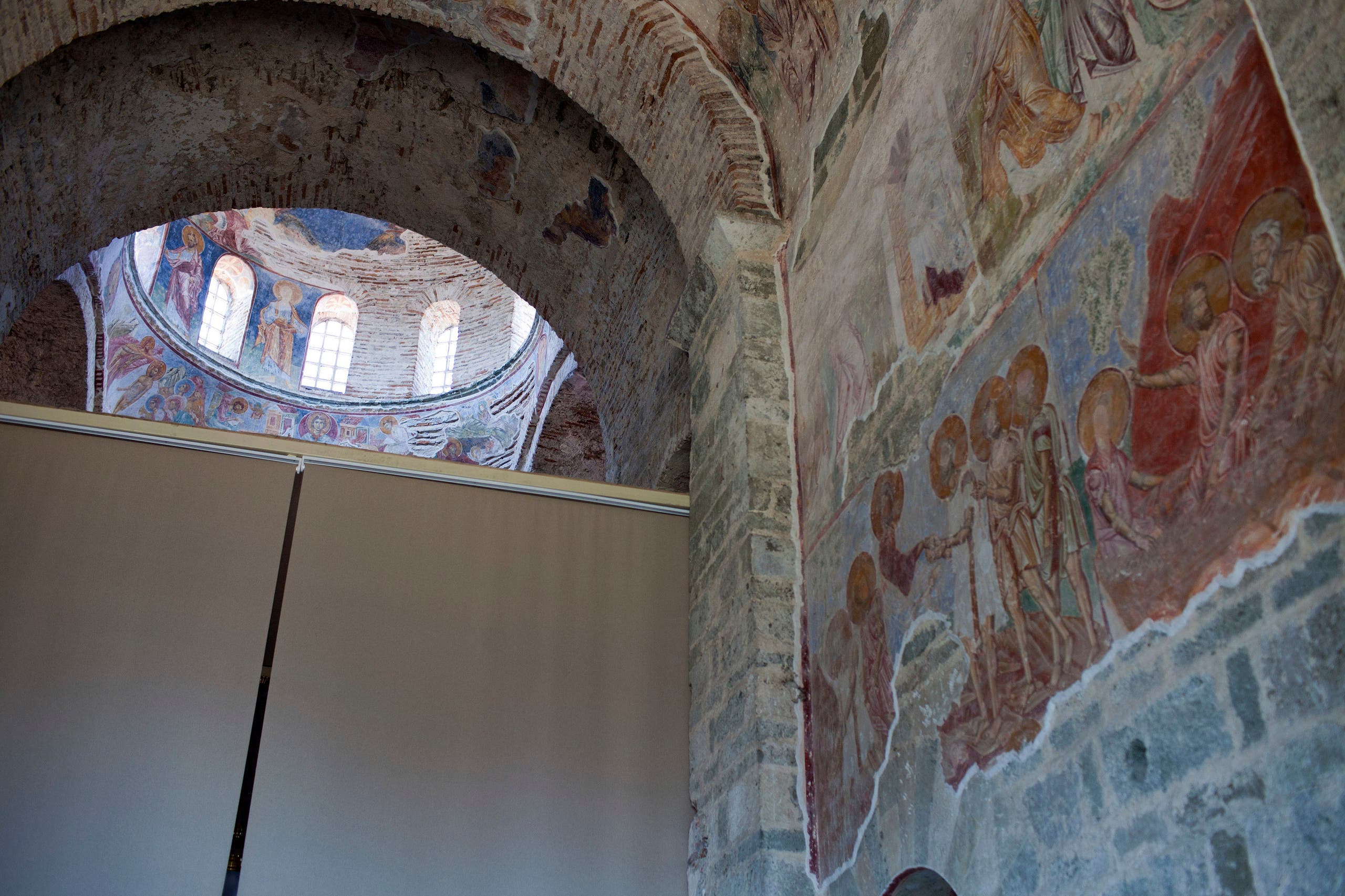Screens are used to cover the frescoes of biblical scenes in the 13th century Hagia Sophia in Trabzon, Turkey on July 9, 2013. (AFP)