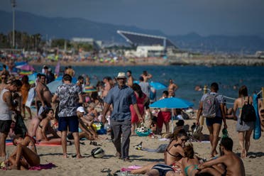 People enjoy the beach in Barcelona on July 18, 2020. (AP)