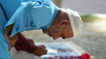 A Pakistani Muslim takes part in Friday prayers at a Deira mosque in Dubai October 29, 2004, during the holy month of Ramadan. (Reuters)