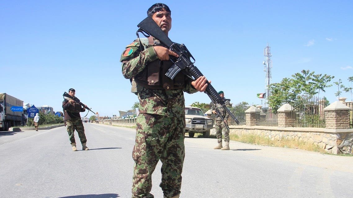 Afghan National Army officers stand guard at the site of a blast in Ghazni province, Afghanistan, on May 18, 2020. (Reuters)