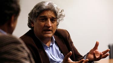 Matiullah Jan, a journalist and columnist, gestures during an interview with Reuters at his office in Islamabad, Pakistan March 13, 2019. (Reuters)