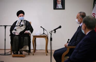 Iran's Supreme Leader Ayatollah Ali Khamenei meets with Iraqi Prime Minister Mustafa al-Kadhimi as they wear protective masks, in Tehran. (Reuters)