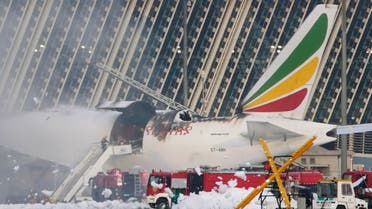 Firefighters work to extinguish the Ethiopian Airlines cargo plane that caught fire at Shanghai Pudong International Airport. (Reuters)