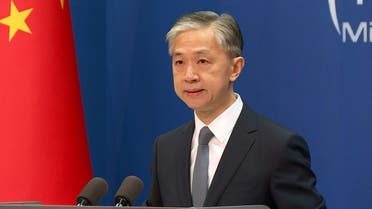 Chinese Foreign Ministry Spokesperson Wang Wenbin arriving at regular foreign ministry news conference in Beijing, China, July 22, 2020. (AFP)