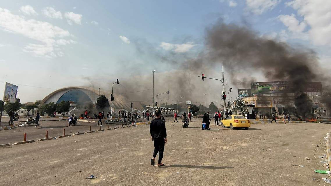 Smoke billows from burning tires during a demonstration in Nasiriyah, the capital of Iraq's southern province of Dhi Qar on November 24, 2019, as protesters cut-off roads and activists call for a general strike. The demonstrations rocking the capital and Shiite-majority south since October 1 are the biggest grassroots movement the country has seen in decades. Sparked by outrage over rampant government corruption, poor services and lack of jobs, they have since gone straight to the source: calling out the ruling system as inherently flawed and in need of a total overhaul.