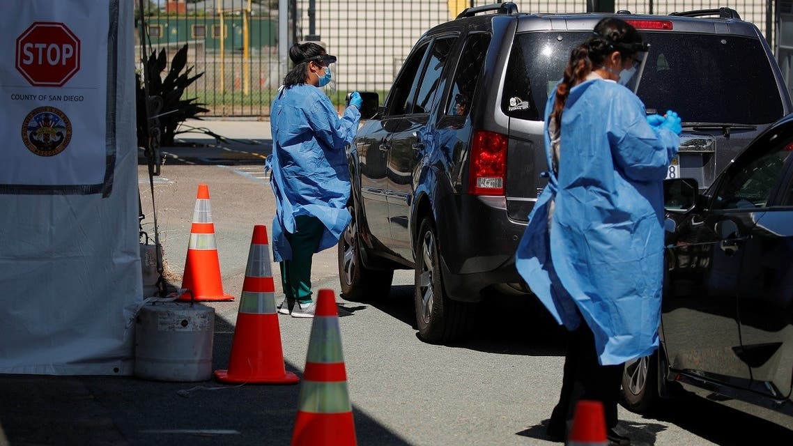 San Diego county nurses work at a newly opened drive through testing site at a closed high school in Imperial Beach, California, U.S., July 16, 2020. (Reuters)