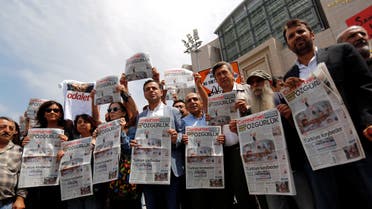 Press freedom activists hold copies of the opposition newspaper Cumhuriyet during a demonstration in solidarity with the jailed members of the newspaper outside a courthouse, in Istanbul, Turkey, July 28, 2017. REUTERS/Murad Sezer