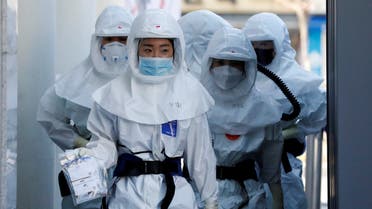 Medical workers head to a hospital facility to treat coronavirus patients amid the rise in confirmed cases of coronavirus disease (COVID-19) in Daegu, South Korea, March 14, 2020. REUTERS/Kim Kyung-Hoon