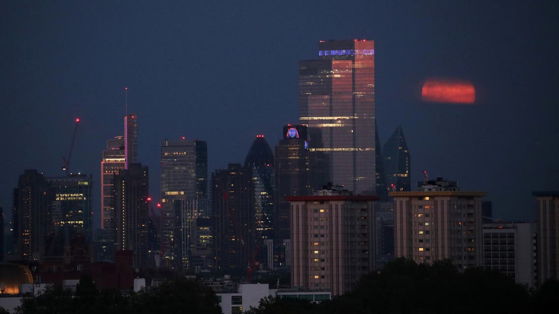 The full moon seen behind the skyscrapers on the London skyline, Britain. (File photo: Reuters)
