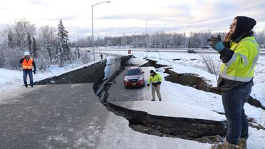 A stranded vehicle lies on a collapsed roadway near the airport after an earthquake in Anchorage, Alaska, U.S. (Reuters)