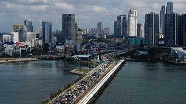 Commuters take the Woodlands Causeway to Singapore from Johor a day before Malaysia imposes a lockdown on travel due to the coronavirus outbreak in Singapore on March 17, 2020. (Reuters)