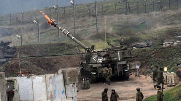 The Israeli army fire artillery shells into Lebanon, following a bomb attack by Lebanon's Hezbollah movement targeting an Israeli army border patrol in the disputed Shebaa Farms area along the Lebanon-Israel ceasefire line on January 4, 2016. Hezbollah said it had targeted an Israeli army border patrol with a bomb in an attack that prompted retaliatory fire from the Jewish state. AFP PHOTO / AVIHU SHAPIRA 