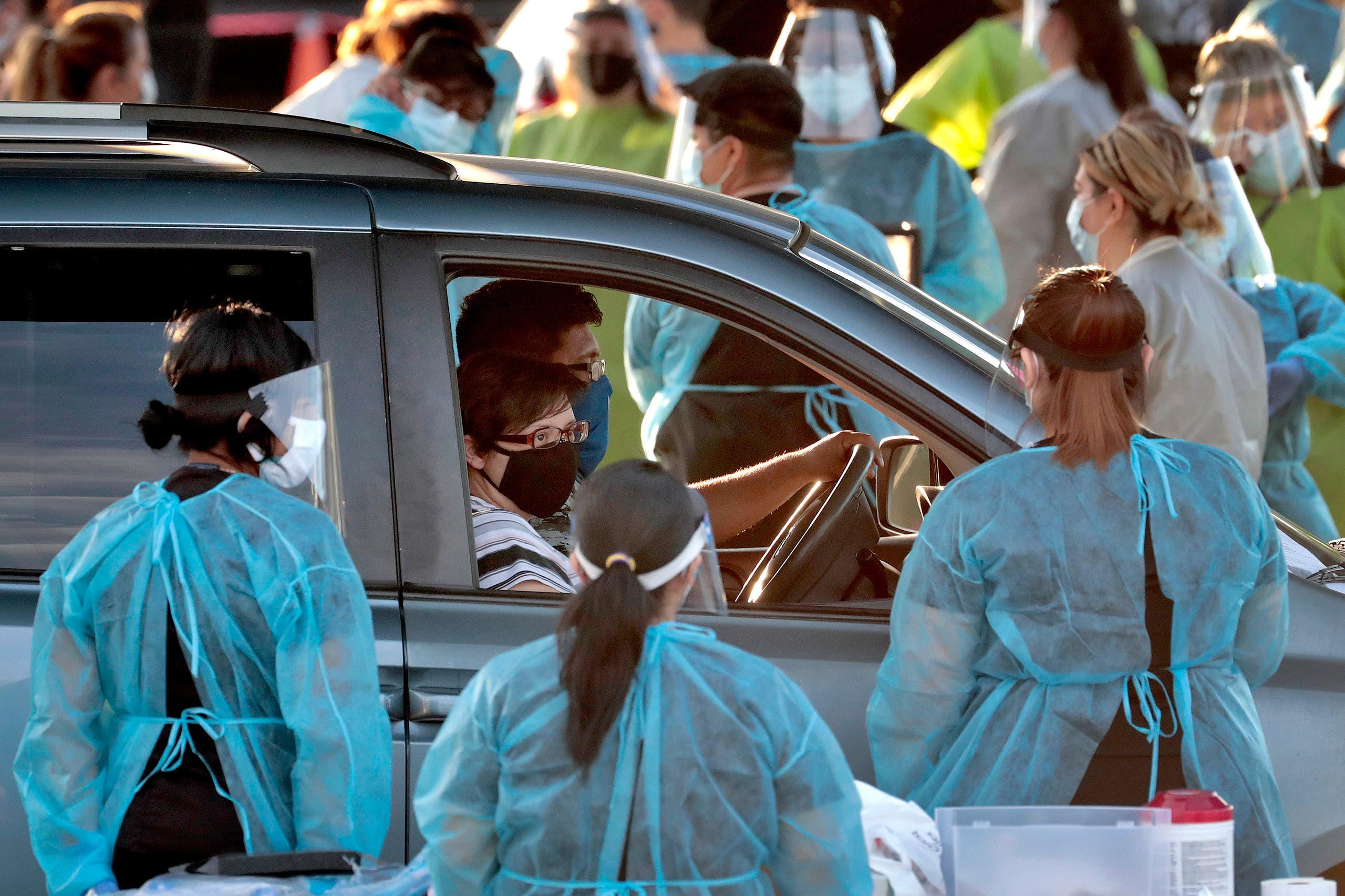 A family pulls up to a drive -thru testing site in Phoenix's western neighborhood of Maryvale on June 27, 2020. (AP)