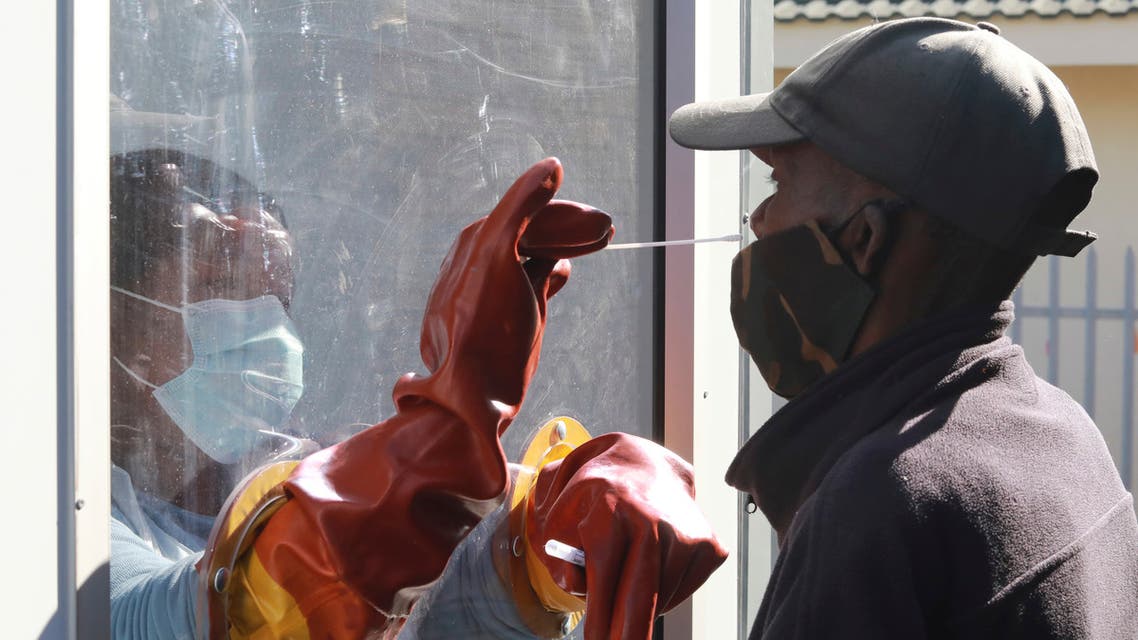 A health worker takes a nasal swab from a patient to test for COVID-19 in Cape Town, South Africa on July 23, 2020. (AP)