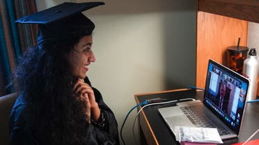 Pakistani student attends her graduation ceremony online in her bedroom due to the coronavirus pandemic, at Georgetown University, in Washington, DC, May 15, 2020. (AFP)