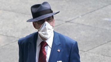 A man dressed in business attire wears a protective mask, following the outbreak of coronavirus disease (COVID-19) in the Manhattan borough of New York City, New York, U.S., July 23, 2020. (Reuters)