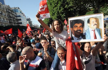 مظاهرات للمطالبة بكشف قتلة شكري بلعيد والبراهيمي في تونس (أرشيفية فرانس برس)