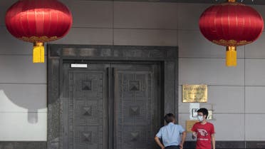 Men try to gain access into the China Consulate General in Houston, Texas, U.S., July 22, 2020. (Reuters)