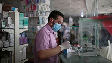 A Yemeni pharmacist at a pharmacy in Sanaa, Yemen on June 25, 2020. (File photo: AP)