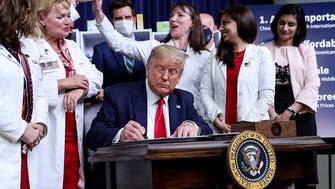 President Trump, facing flak over coronavirus, signs orders to lower drug prices